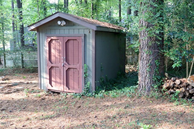 3404 Gemini Dr, Raleigh, NC 27604 - view of shed with a forest view and fence