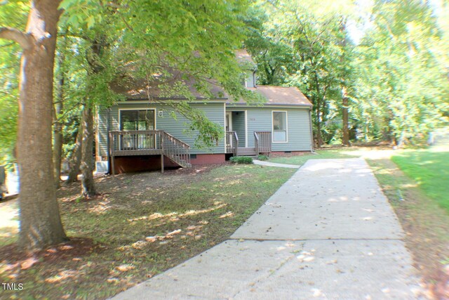 3404 Gemini Dr, Raleigh, NC 27604 - view of front of home with a wooden deck, crawl space, and driveway