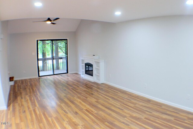 3404 Gemini Dr, Raleigh, NC 27604 - unfurnished living room featuring a ceiling fan, a glass covered fireplace, light wood-type flooring, baseboards, and recessed lighting