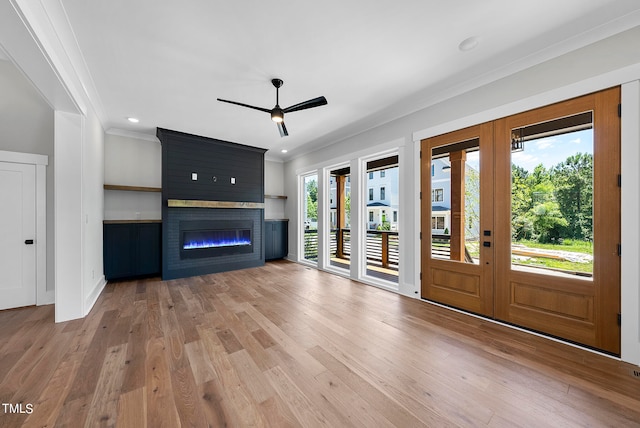 foyer featuring a fireplace, hardwood / wood-style floors, and a wealth of natural light