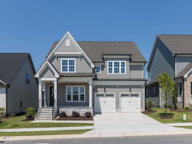 craftsman-style house featuring a garage and covered porch