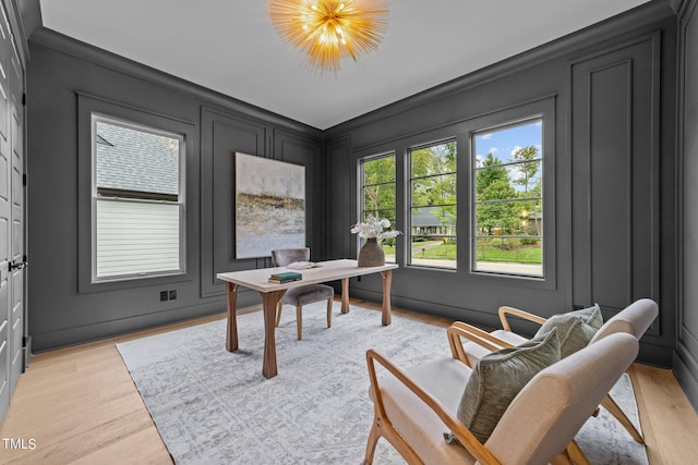 office area with a chandelier and light hardwood / wood-style floors