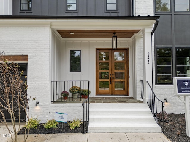 entrance to property featuring french doors and a porch