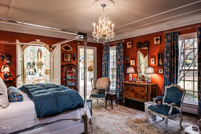 bedroom featuring a chandelier, ornamental molding, and dark wood-type flooring