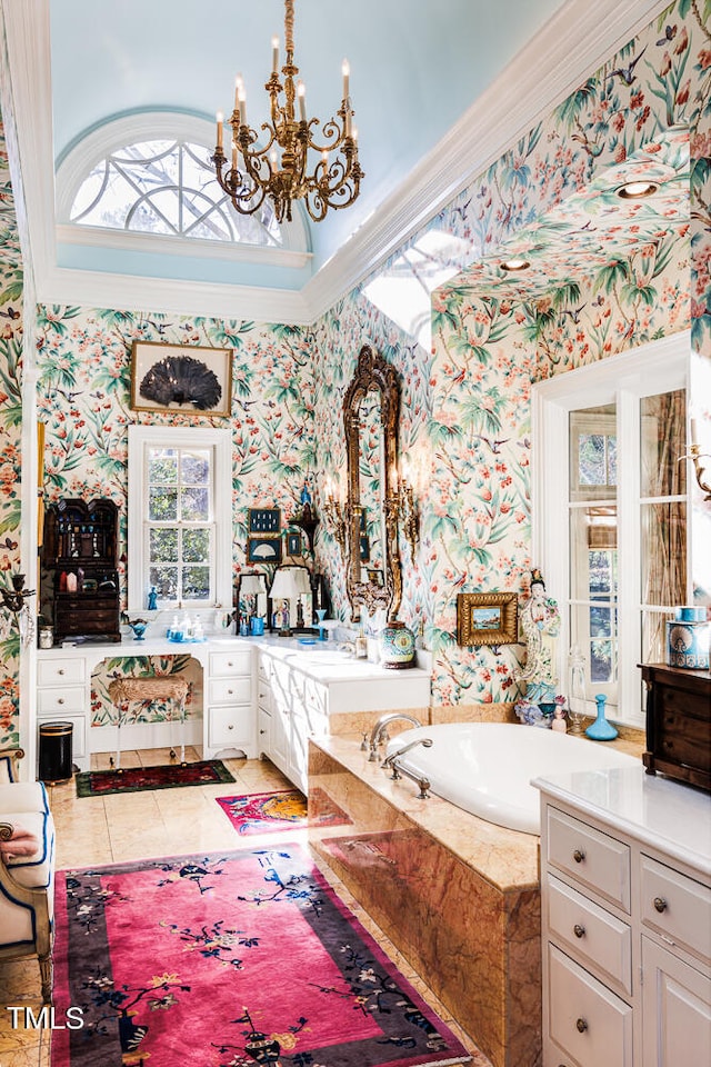 bathroom featuring ornamental molding, a chandelier, tiled tub, tile floors, and vanity