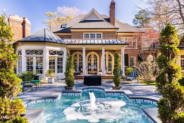 rear view of house with a patio area