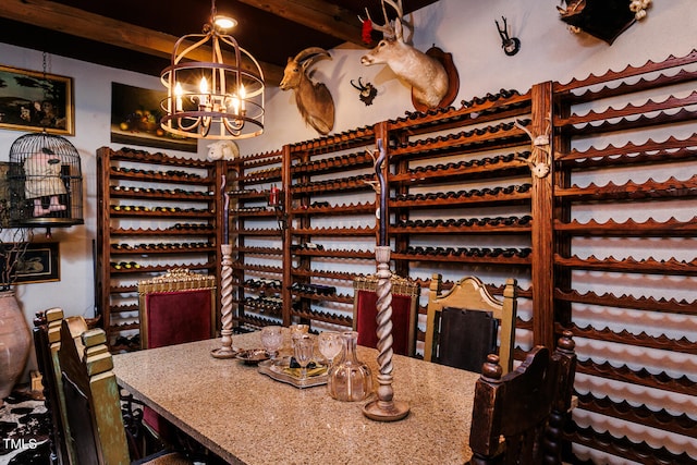 wine room featuring a chandelier