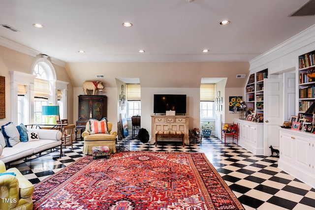 living room featuring crown molding, built in shelves, and tile floors