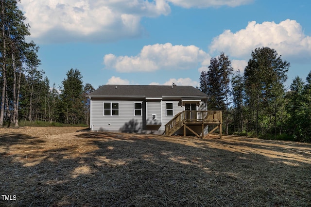 back of house featuring a deck