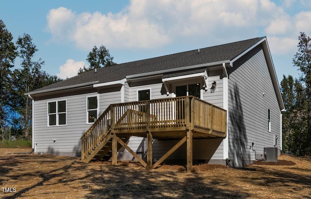 rear view of house with a wooden deck