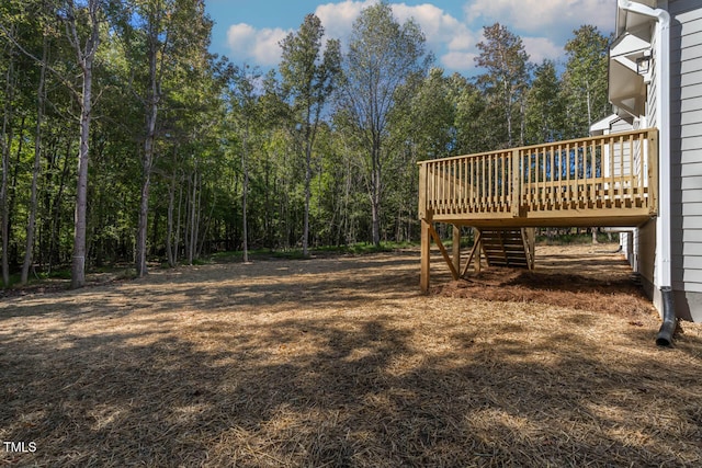 view of yard with a wooden deck