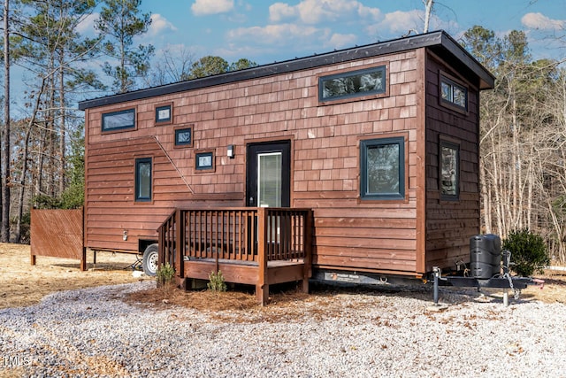 back of house featuring a deck