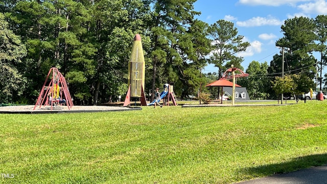 surrounding community with a playground and a lawn