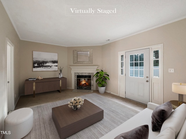 carpeted living room featuring a premium fireplace and crown molding