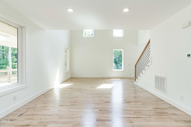 empty room with light hardwood / wood-style floors