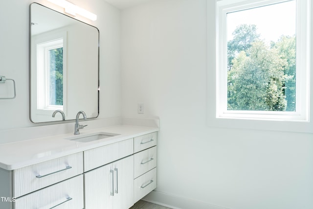 bathroom featuring vanity and a healthy amount of sunlight