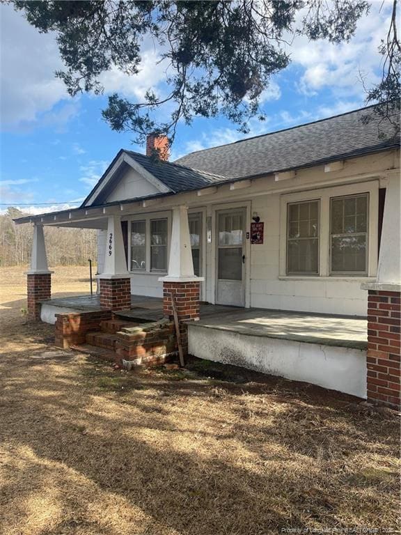 back of house with a porch