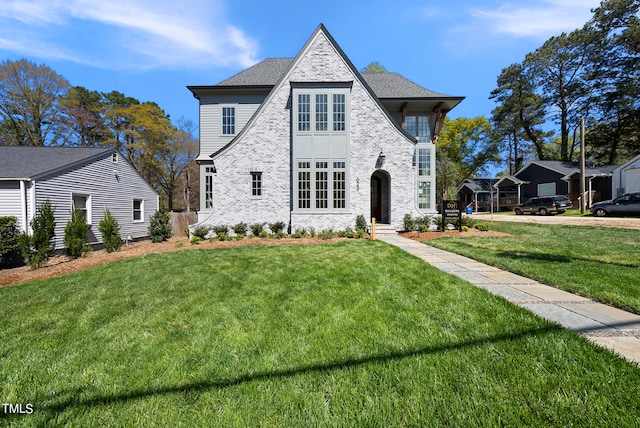 view of front of home with a front lawn