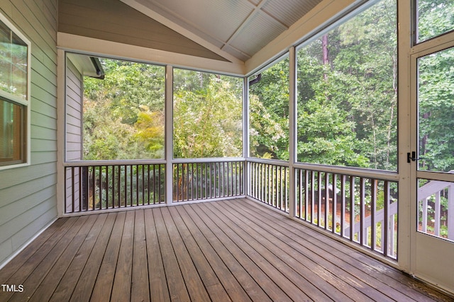 unfurnished sunroom with lofted ceiling