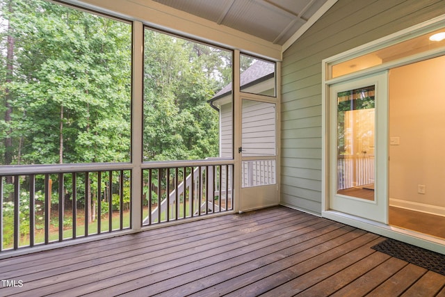 unfurnished sunroom with vaulted ceiling