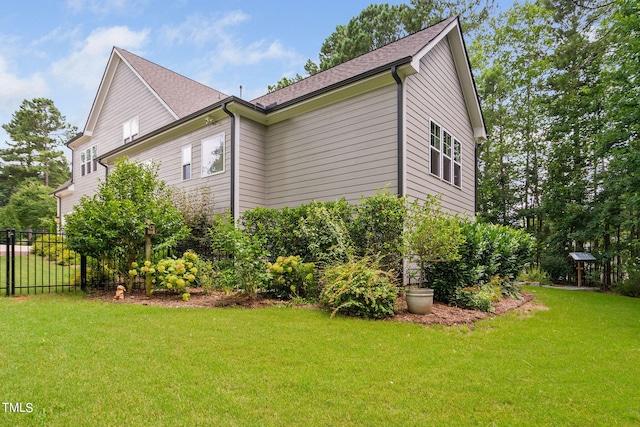 view of home's exterior featuring a lawn