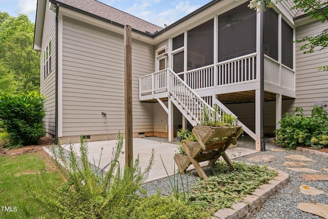 back of house featuring a patio and a sunroom