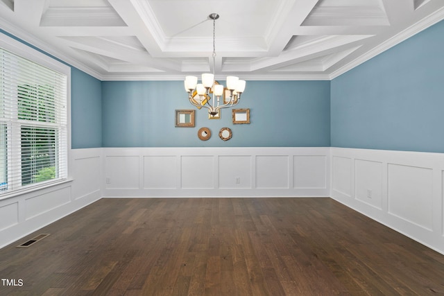 empty room featuring coffered ceiling, beamed ceiling, an inviting chandelier, and crown molding