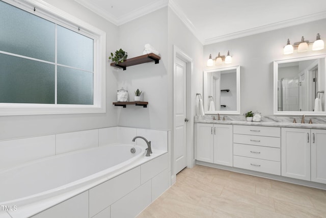 bathroom featuring tiled bath, tile patterned floors, crown molding, and vanity