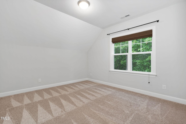 bonus room featuring carpet floors and vaulted ceiling