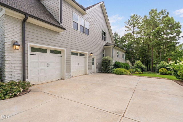 view of property exterior featuring a garage