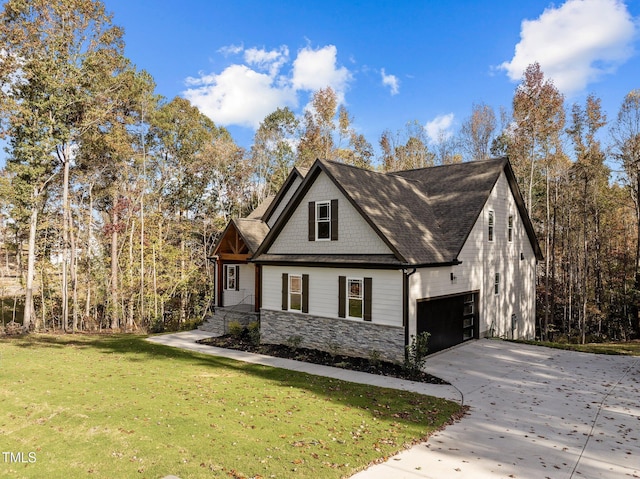 143 Hook Dr Lot 23, Fuquay Varina, NC 27526 - view of side of home with driveway, stone siding, a lawn, and an attached garage