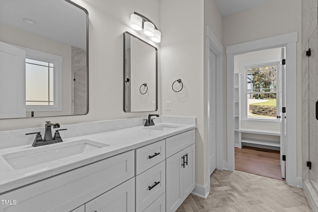 bathroom featuring vanity and parquet floors