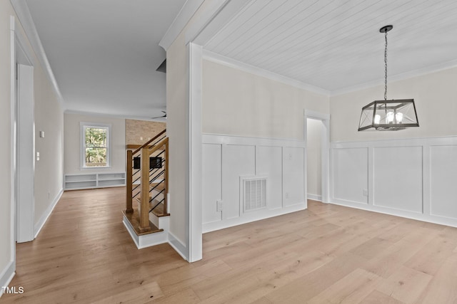 dining space featuring ceiling fan with notable chandelier, crown molding, wood ceiling, and light wood-type flooring