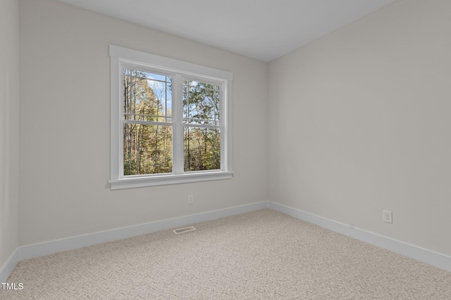 143 Hook Dr Lot 23, Fuquay Varina, NC 27526 - spare room featuring carpet and baseboards