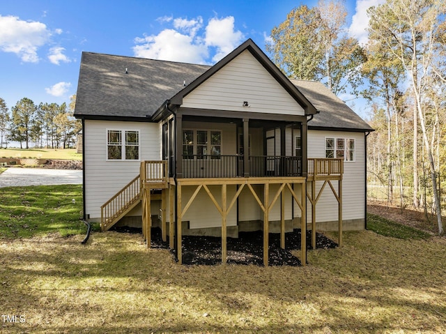 143 Hook Dr Lot 23, Fuquay Varina, NC 27526 - back of house featuring a sunroom, stairway, a lawn, roof with shingles, and a wooden deck