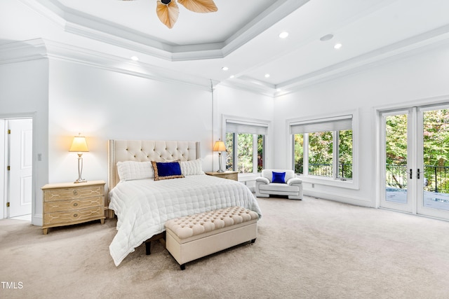 carpeted bedroom with crown molding, multiple windows, and access to exterior