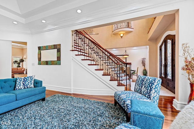 living room featuring ornamental molding, french doors, and wood-type flooring