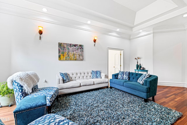 living room featuring crown molding and hardwood / wood-style flooring