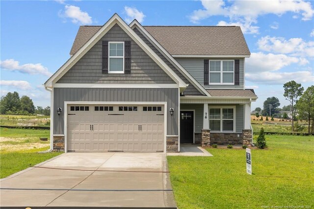 craftsman-style house with a front lawn