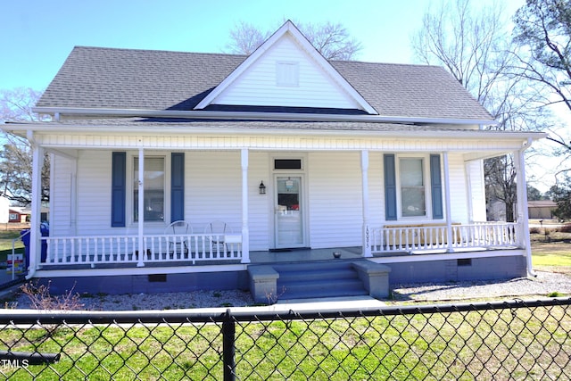 view of front of home featuring a front lawn and covered porch