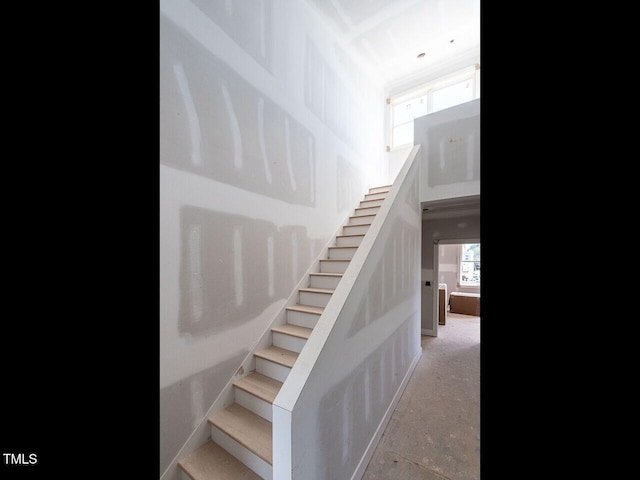 stairway with concrete floors