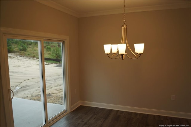 interior space featuring dark wood-type flooring, a notable chandelier, baseboards, and ornamental molding