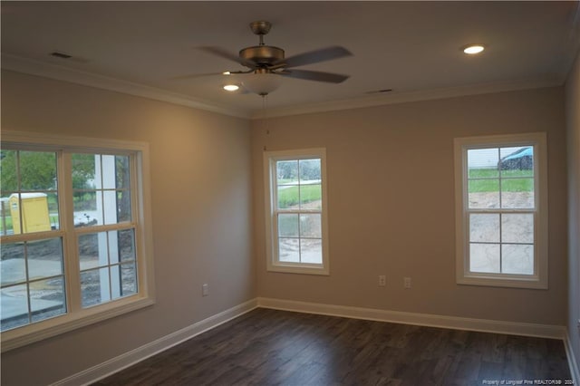 unfurnished room featuring ceiling fan, baseboards, ornamental molding, and dark wood finished floors