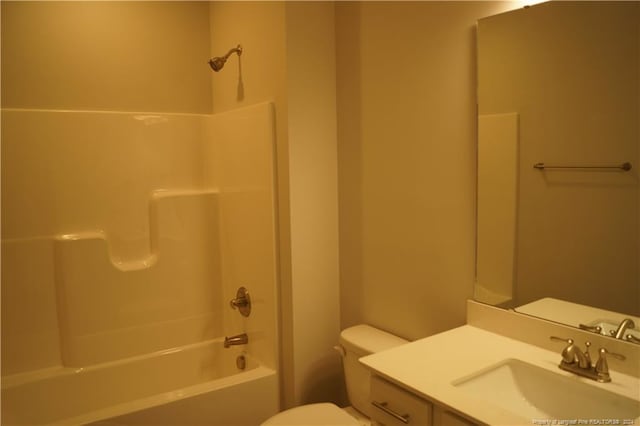 bathroom featuring tub / shower combination, toilet, and vanity