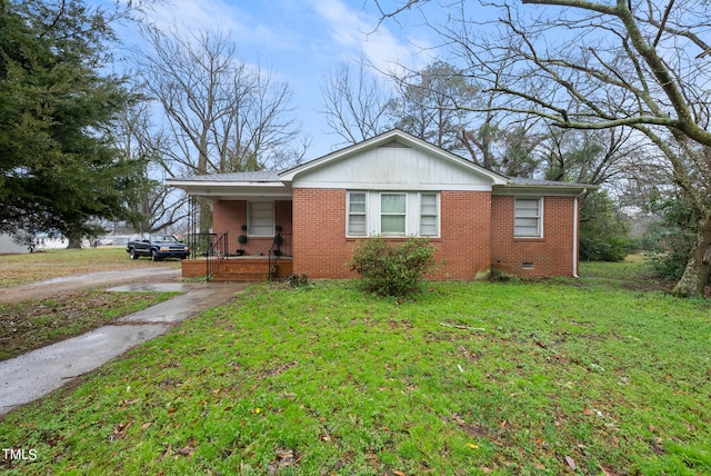 bungalow-style home with a front lawn