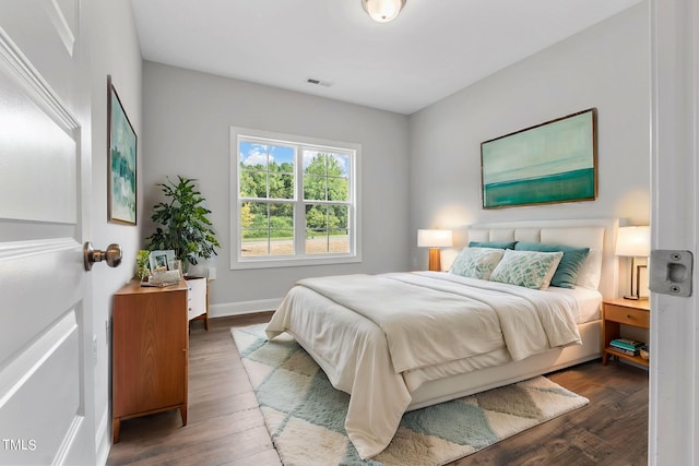 bedroom featuring dark hardwood / wood-style flooring