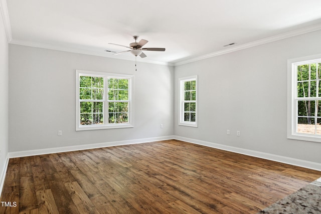 empty room with crown molding, a healthy amount of sunlight, dark hardwood / wood-style flooring, and ceiling fan