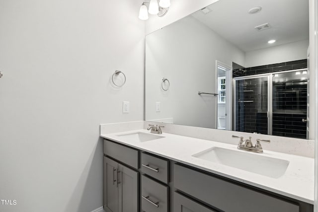 bathroom featuring vanity, toilet, and walk in shower