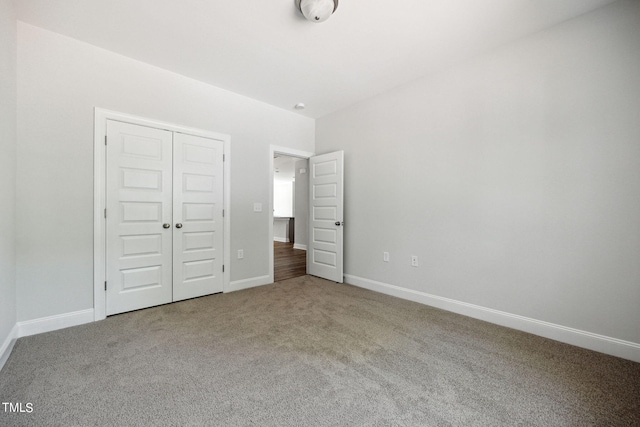 unfurnished bedroom featuring a closet and carpet