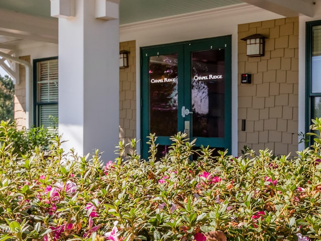 entrance to property featuring covered porch